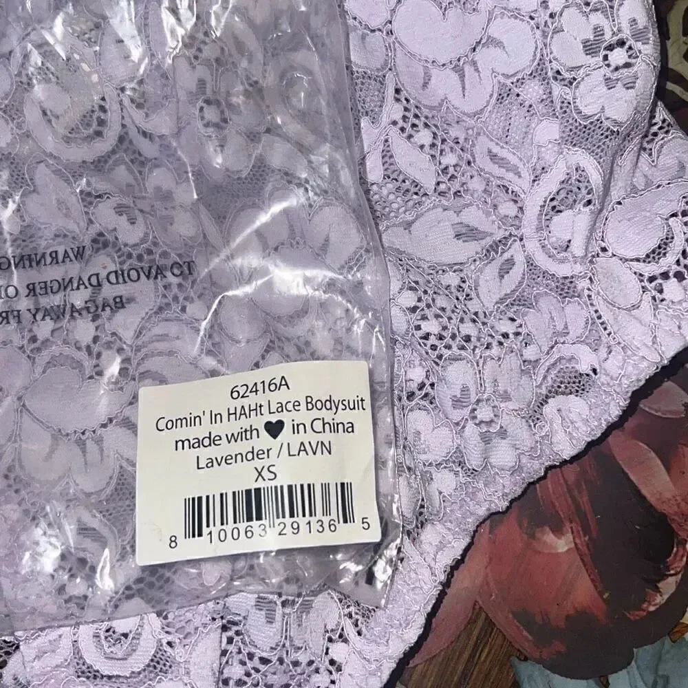 We are HAH Free People NWT comin in haht lace bodysuit purple XS